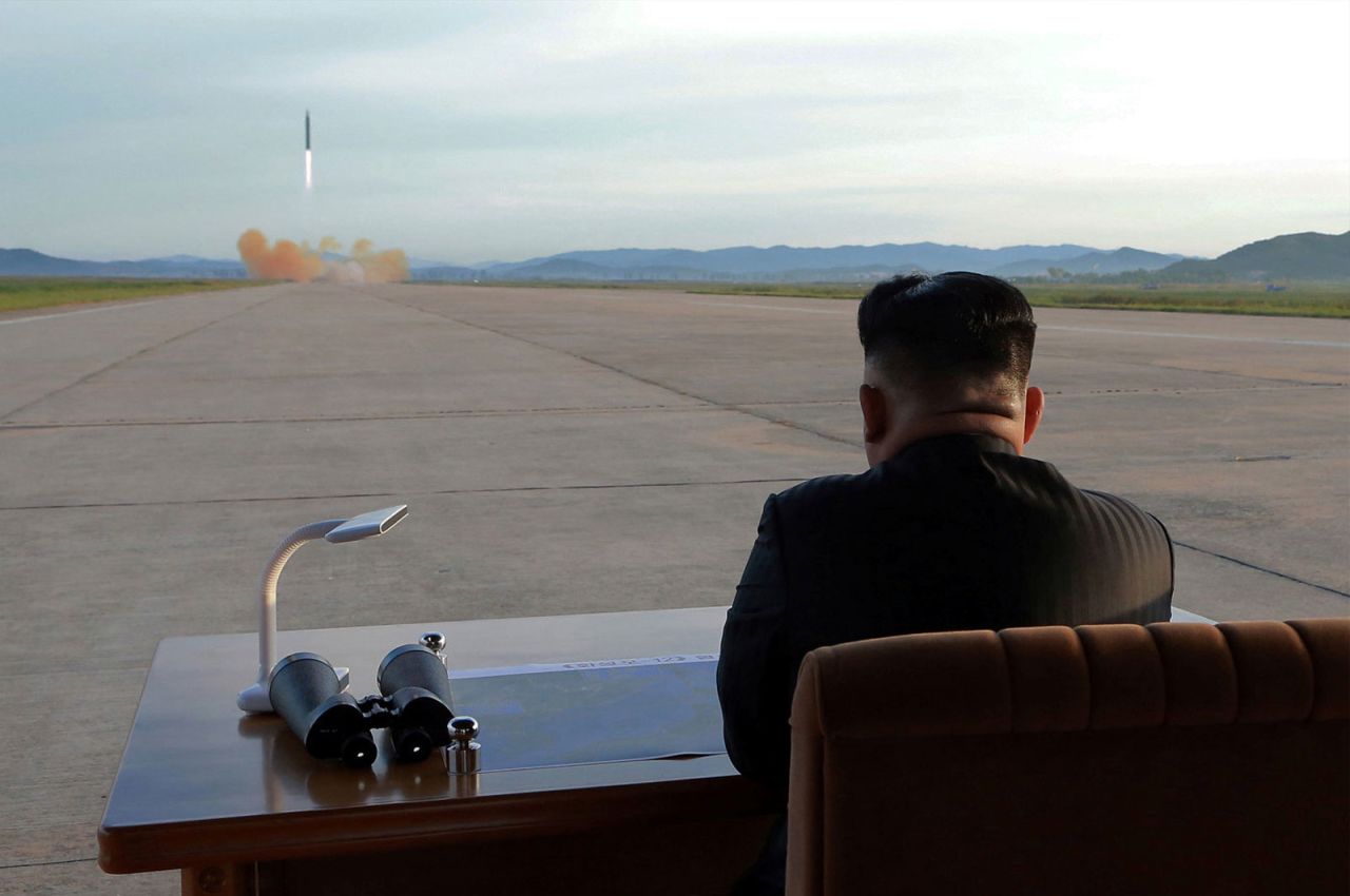 In this undated photo provided by North Korea's state-run news agency in September 2017, Kim watches the launch of what was said to be a Hwasong-12 missile.