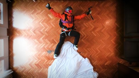 Philipp Klein Herrero scaling a snowy mountain, in his apartment.