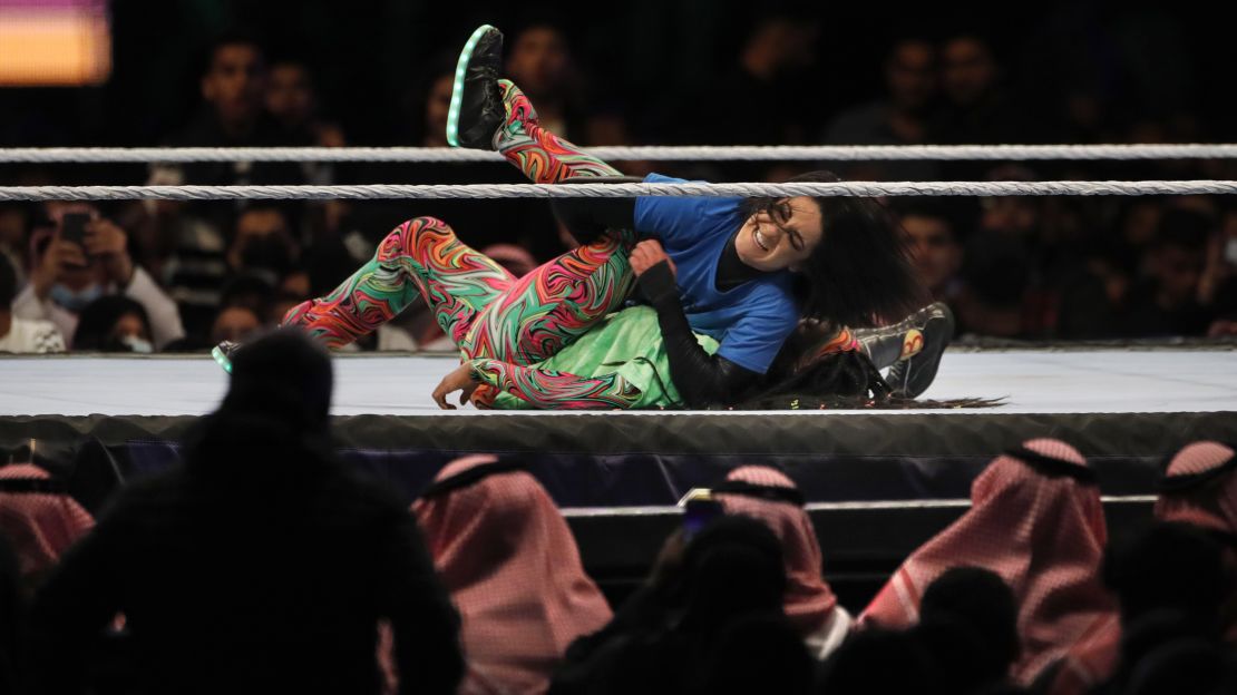 SmackDown Women's Champion Bayley, at top, wrestles with Naomi at WWE Super ShowDown in the second women's match ever to be held in Riyadh, Saudi Arabia.