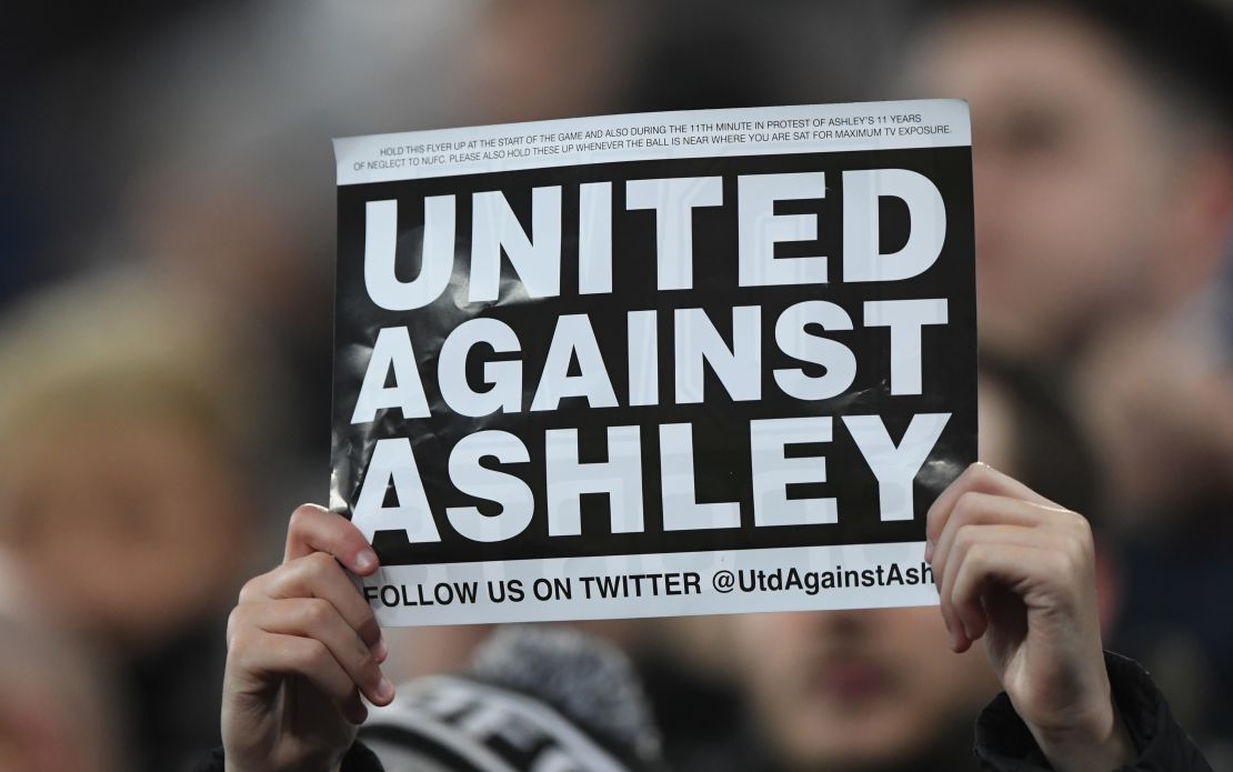 A fan protests against Mike Ashley during Newcastle's game against  Man City last season.