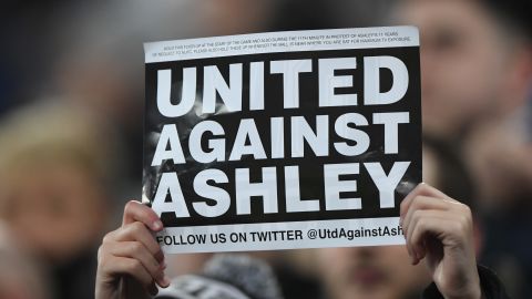 A fan protests against Mike Ashley during Newcastle's game against  Man City last season.