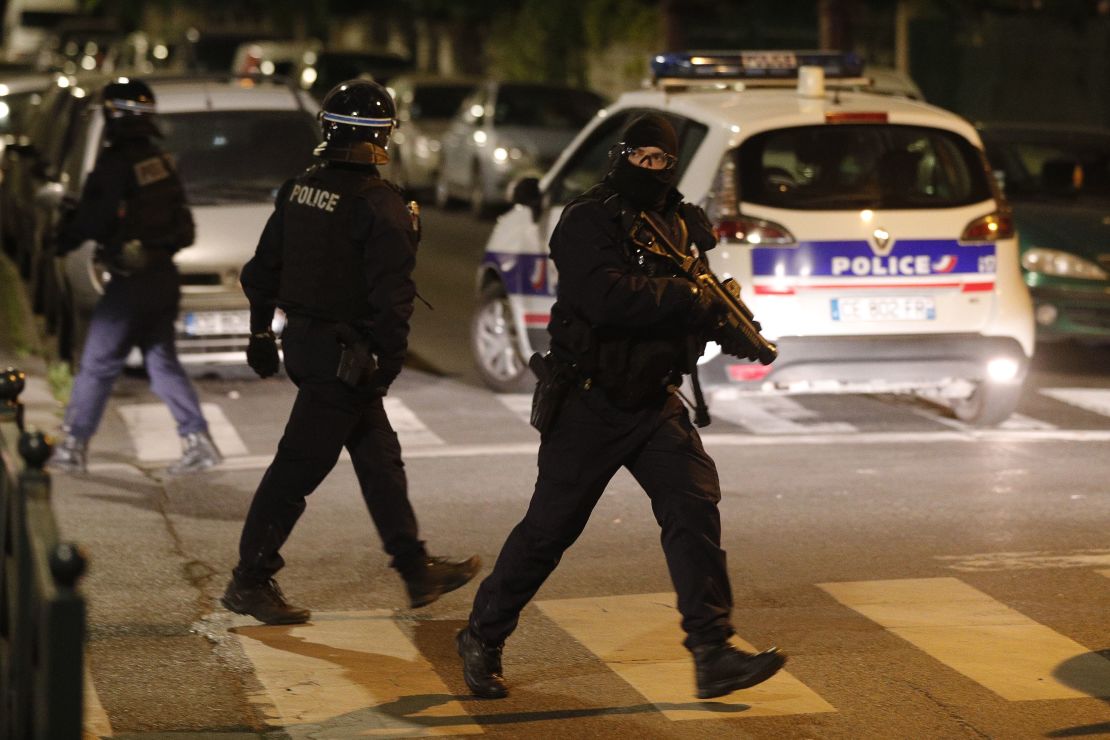 A French police officer with a 40-millimeter rubber defensive bullet launcher LBD (LBD40) walks in a street during clashes in Villeneuve-la-Garenne last Monday.