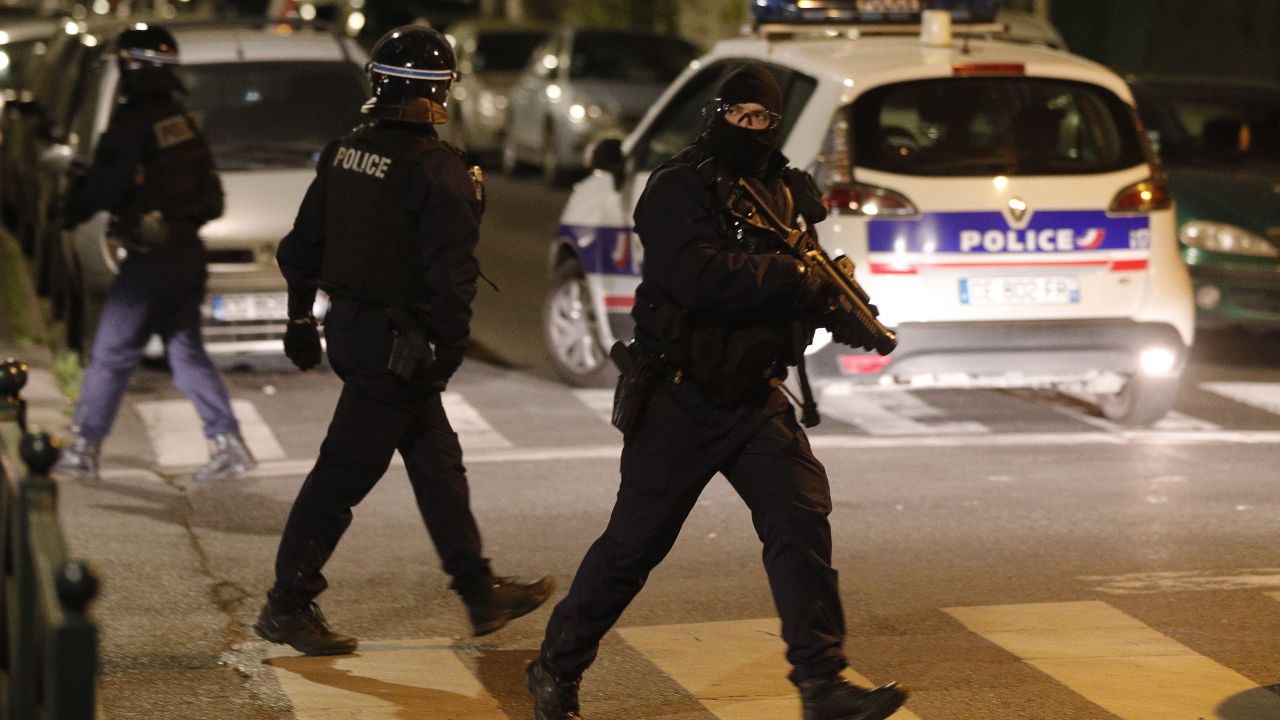A French police officer with a 40-millimeter rubber defensive bullet launcher LBD (LBD40) walks in a street during clashes in Villeneuve-la-Garenne last Monday.