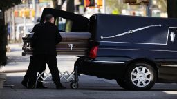 NEW YORK, NY - APRIL 16: A casket is placed into a hearse outside of a funeral home in the heavily Orthodox Borough Park neighborhood of Brooklyn which has scene a large number of deaths due to the coronavirus on April 16, 2020 in New York City. Hospitals in New York City, which have been especially hard hit by the coronavirus, are still struggling with an influx of COVID-19 cases.  (Photo by Spencer Platt/Getty Images)