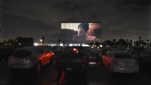 Viewers in cars watch the animated film "Onward" at California's Paramount Drive-In Theatres on March 19. 