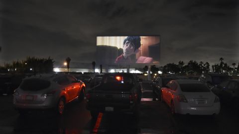 Viewers in cars watch the animated film "Onward" at California's Paramount Drive-In Theatres on March 19.