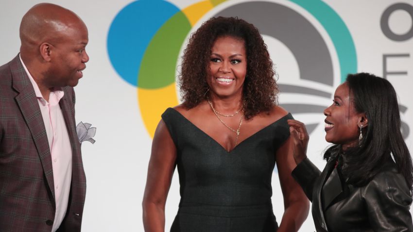 CHICAGO, ILLINOIS - OCTOBER 29: Former first lady Michelle Obama (C), her brother Craig Robinson, and journalist Isabel Wilkerson speak to guests at the Obama Foundation Summit at Illinois Institute of Technology on October 29, 2019 in Chicago, Illinois. The Summit is an annual event hosted by the Obama Foundation. The 2019 theme is "Places Reveal Our Purpose". (Photo by Scott Olson/Getty Images)