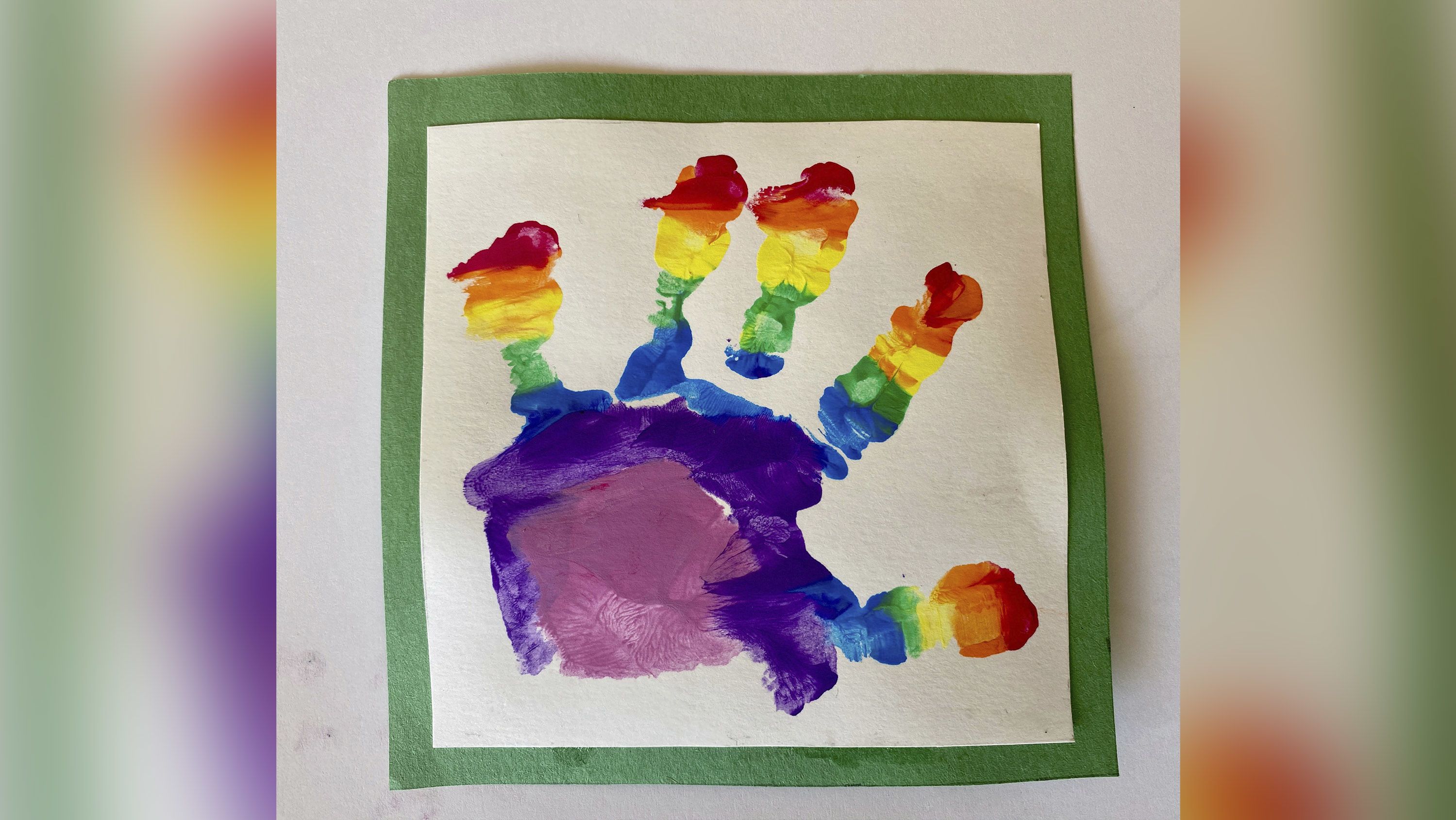 Prince Louis painted his own rainbow picture, using a hand print. 