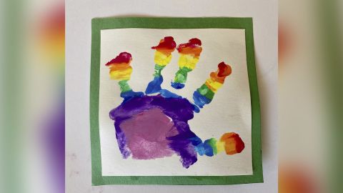 Prince Louis painted his own rainbow picture, using a hand print.