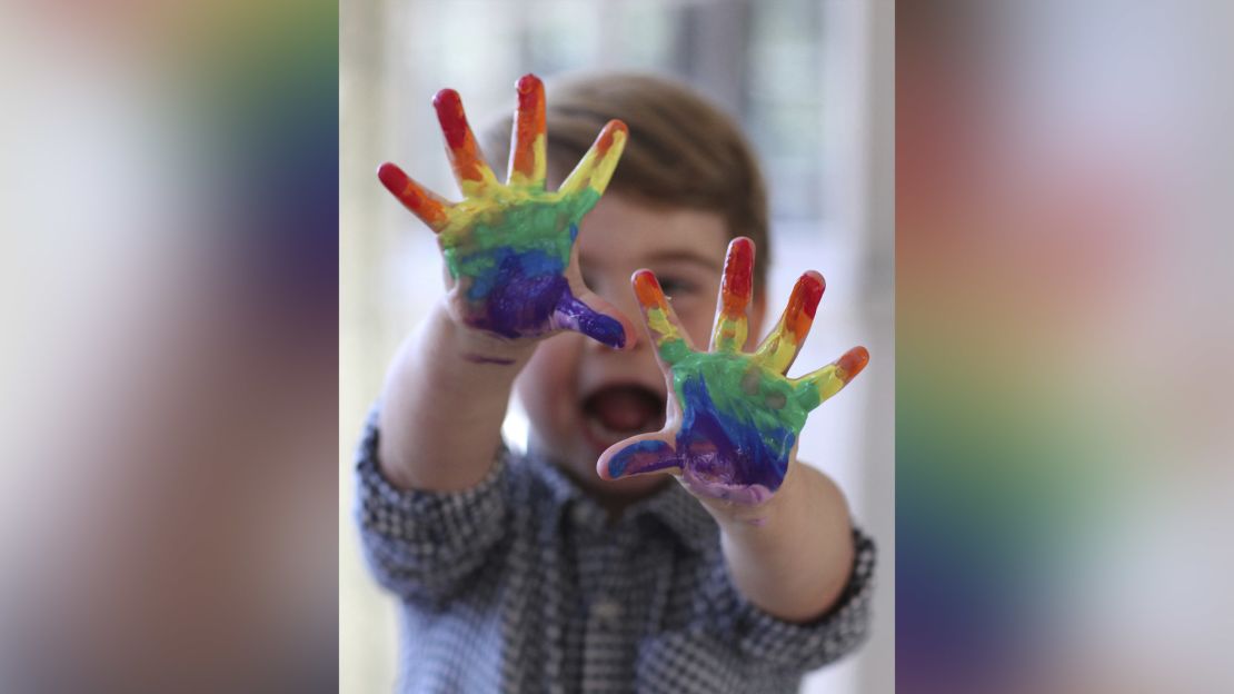 Prince Louis painted a rainbow in photos released to mark his second birthday.