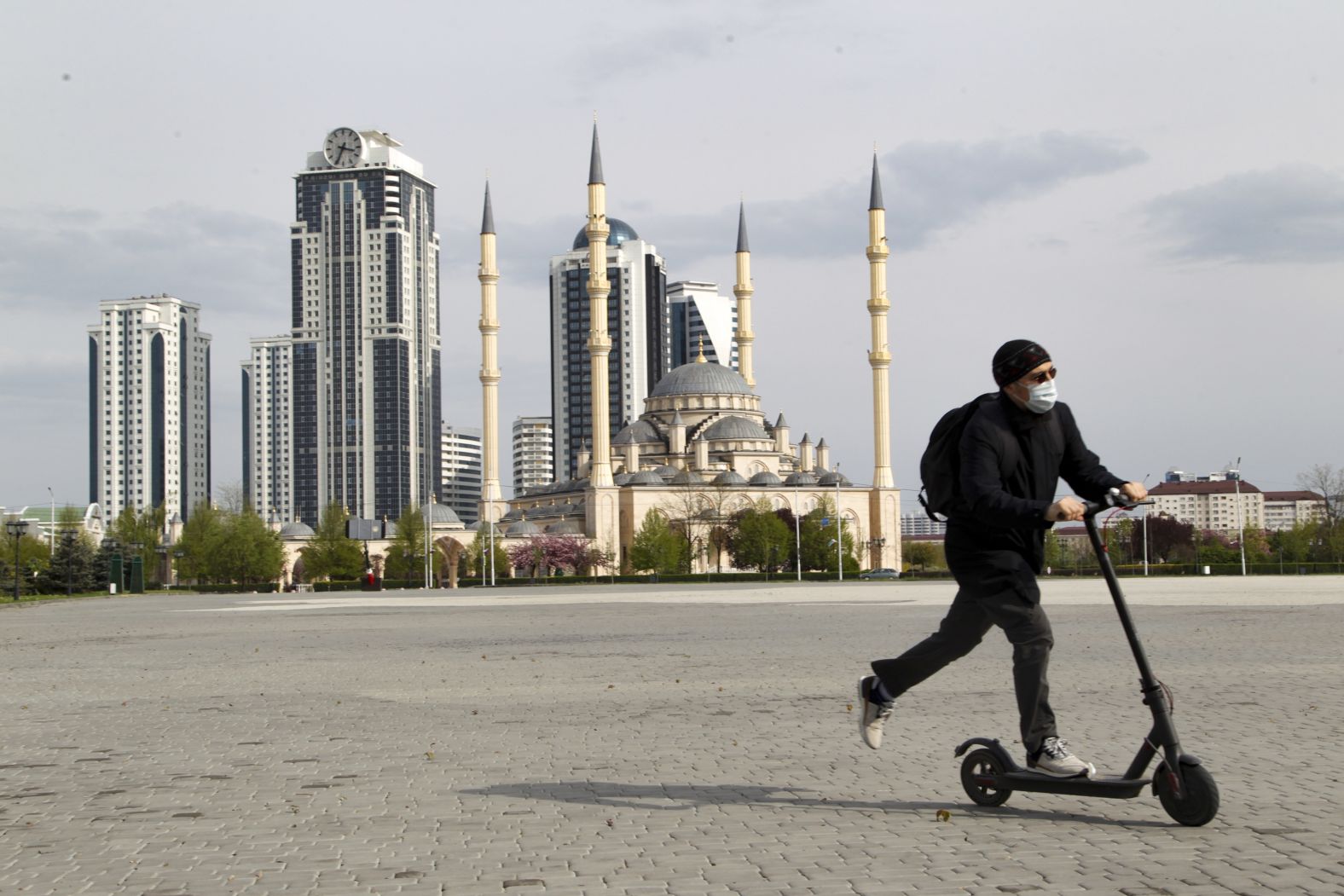 A man rides a scooter in front of a closed mosque in Grozny, Russia, on April 23.