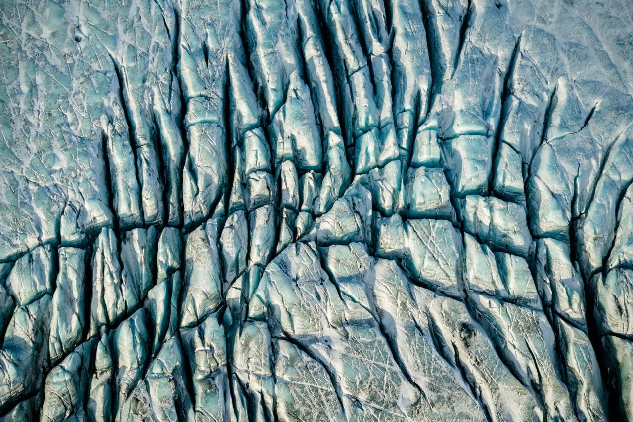 When Burkard's pilot, Haraldur Diego, began telling him about the uncertain future of Iceland's rivers due to an increasing number of hydropower plants in the country, Burkard's work took an environmental turn. From the book "At Glacier's End."