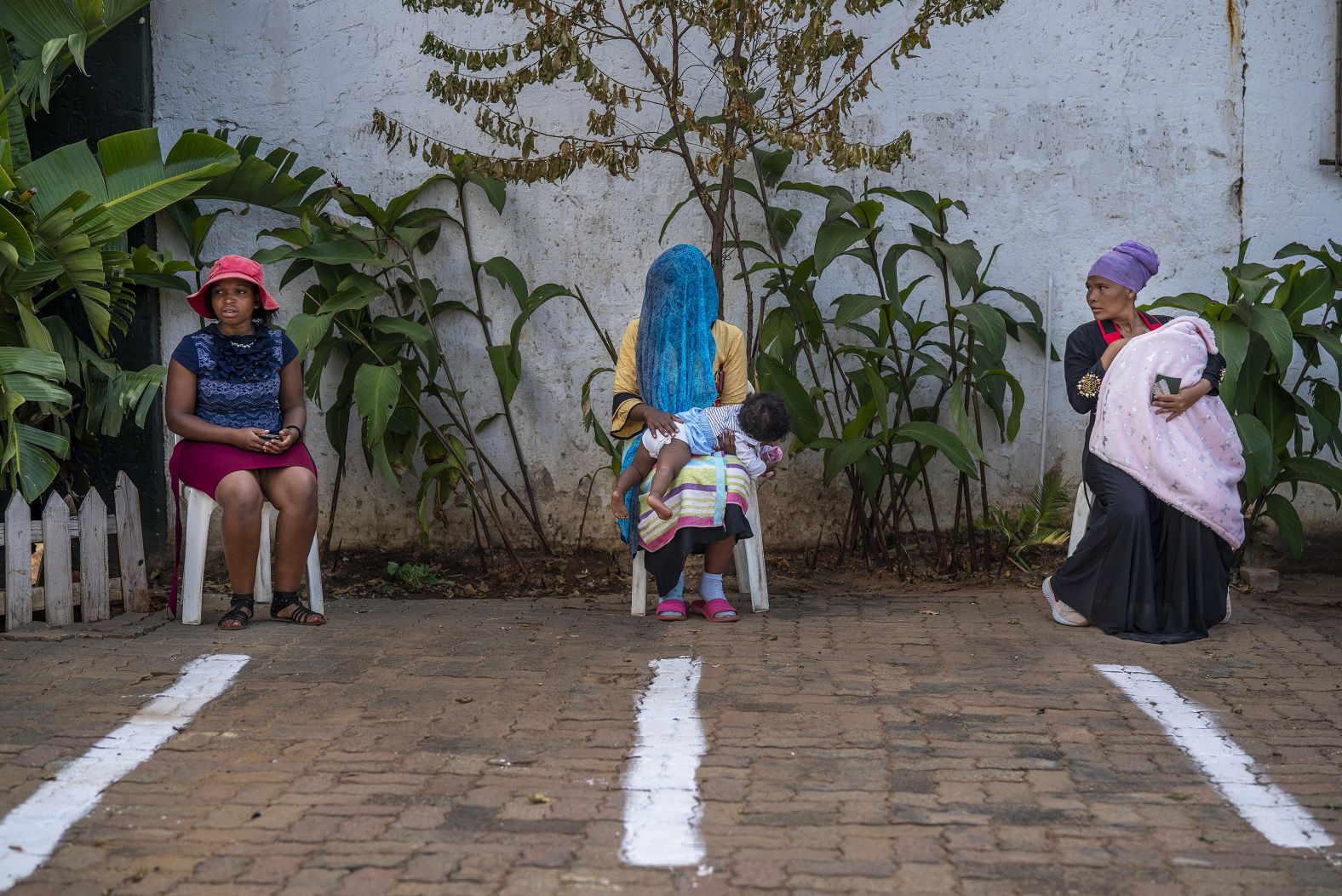 Women wait to receive Ramadan candies at a mosque in Springs, South Africa.