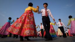 TOPSHOT - Students take part in a mass dance event marking the anniversary of the end of the Korean War on Kim Il Sung square in Pyongyang on July 27, 2018. - Hostilities ceased 65 years ago in an armistice between the US-led United Nations forces and the North Koreans and their Chinese allies, rather than a peace treaty, leaving the peninsula technically still in a state of conflict. The two sides had fought each other to a standstill, millions were dead and Korea was a war-ravaged ruin, now divided by the Demilitarized Zone, but the North proclaims it as a victory, and it is a key plank of the Kim dynasty's claim to a right to rule. (Photo by Ed JONES / AFP)        (Photo credit should read ED JONES/AFP via Getty Images)