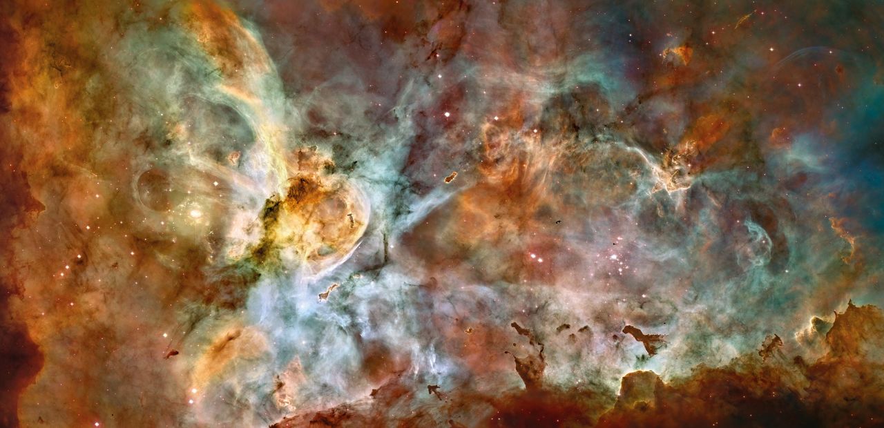 This huge nebula is 7,500 light years from Earth in the constellation Carina. It's one of the largest and brightest nebulas and is a nursery for new stars. It also has several stars estimated to be at least 50 to 100 times the mass of our Sun, including Eta Carinae, one of the brightest stars known and one of the most massive stars in the Milky Way Galaxy.