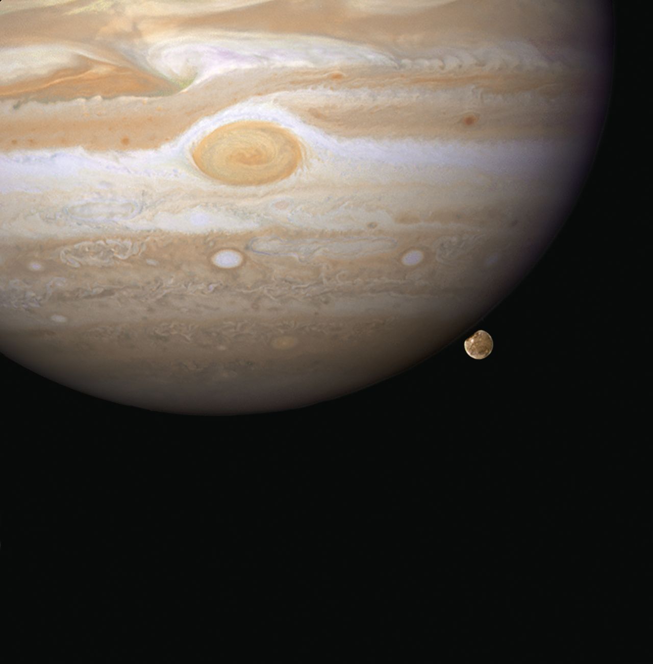 Hubble snapped this image in 2007 of Ganymede appearing to peek out from beneath Jupiter. Ganymede is the largest moon in our solar system, and it's even bigger than Mercury.
