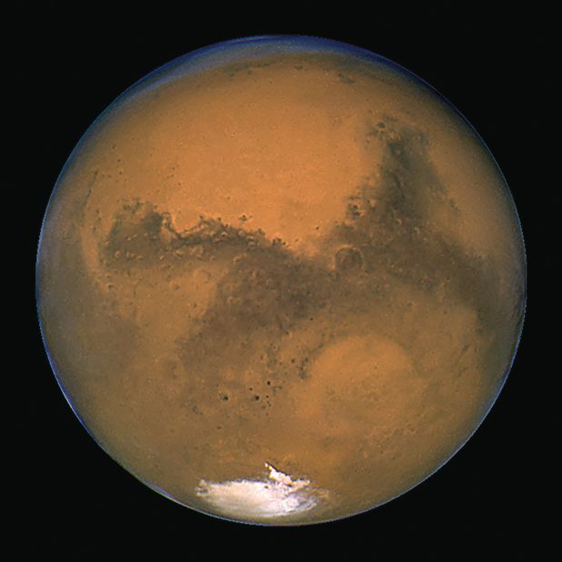 Hubble has given us many images of our neighbor Mars. This image was taken in 2003 when Mars made its closest approach in nearly 60,000 years. On August 27, 2003, the two worlds were only 34.6 million miles apart from center to center. By contrast, Mars can be about 249 million miles away from Earth.