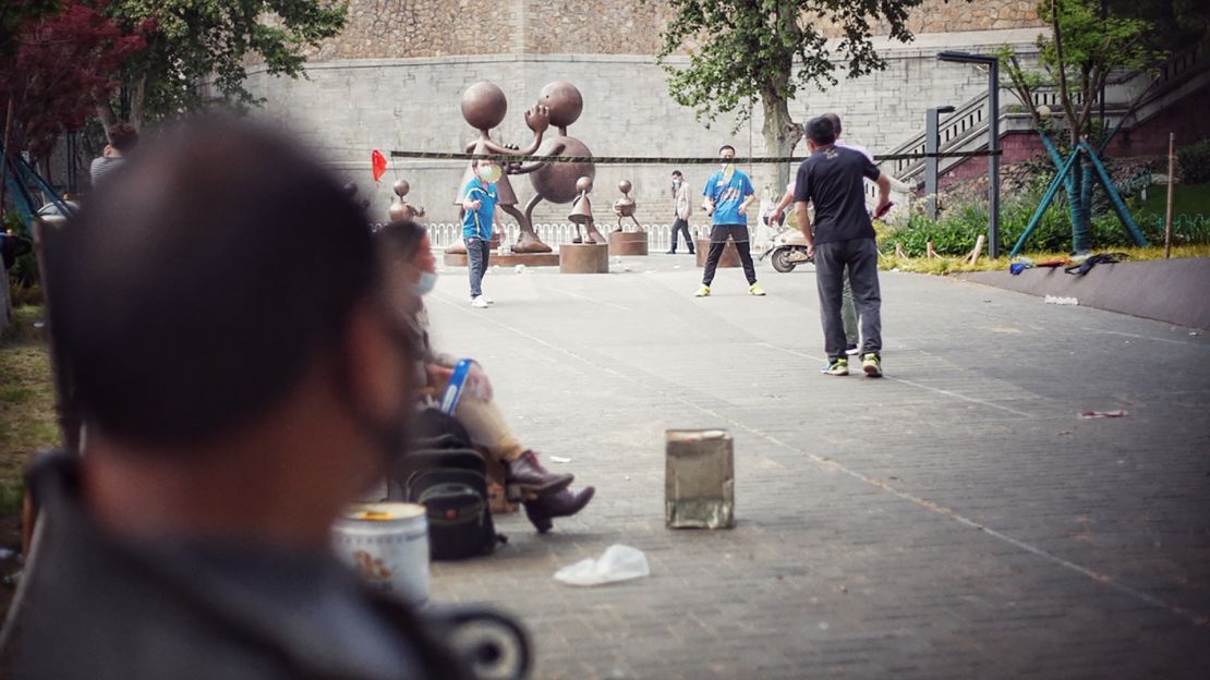 A group of Wuhan citizens come together to play badminton in a park after lockdown on April 23.