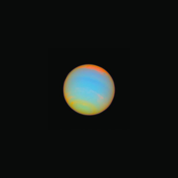 Hubble captured this image of the distant blue-green world Neptune in 2005. Fourteen different colored filters were used to help scientists learn more about Neptune's atmosphere. Neptune is about 2.8 billion miles from Earth.
