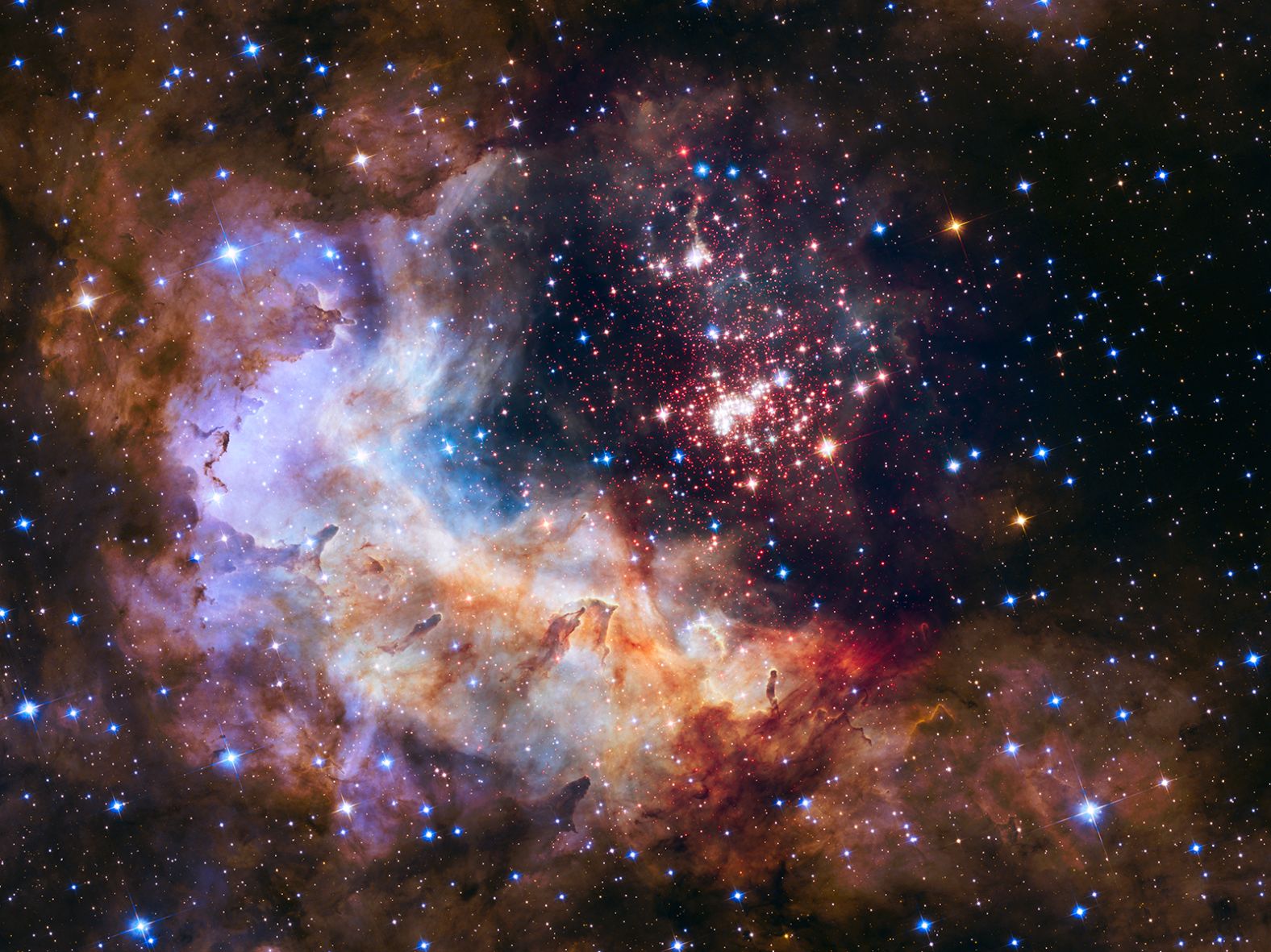 Fireworks are even more beautiful in space. Hubble captured this image of a giant cluster of 3,000 stars in 2015. It's called Westerlund 2, located 20,000 light-years away from Earth.