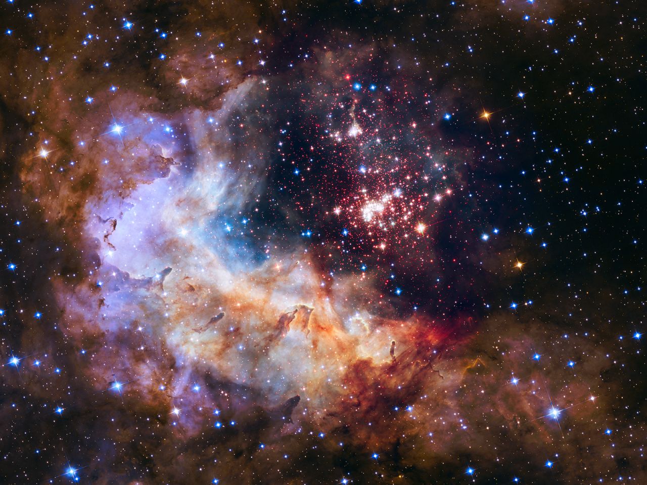 Fireworks are even more beautiful in space. Hubble captured this image of a giant cluster of 3,000 stars in 2015. It's called Westerlund 2, located 20,000 light-years away from Earth.