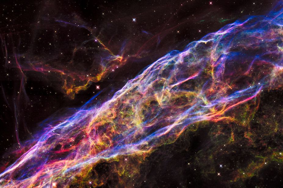 This is a detailed look at the section of a slowly expanding supernova, or the remains of an exploded star. Hubble took this image in 2015 of the Veil Nebula 2,100 light-years away. The star was once 20 times more massive than our sun, but only wisps of gas remain. 