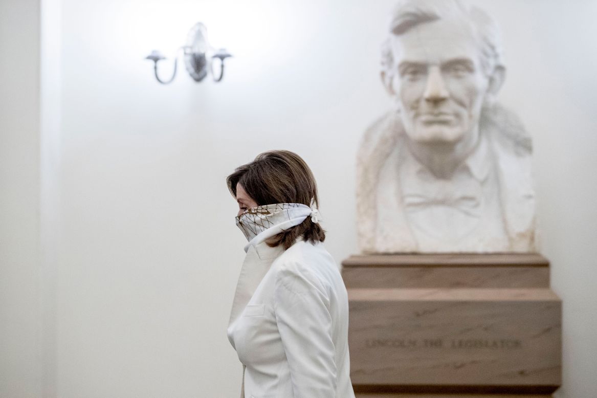 House Speaker Nancy Pelosi walks in front of bust of President Abraham Lincoln as she arrives on Capitol Hill on Thursday, April 23.