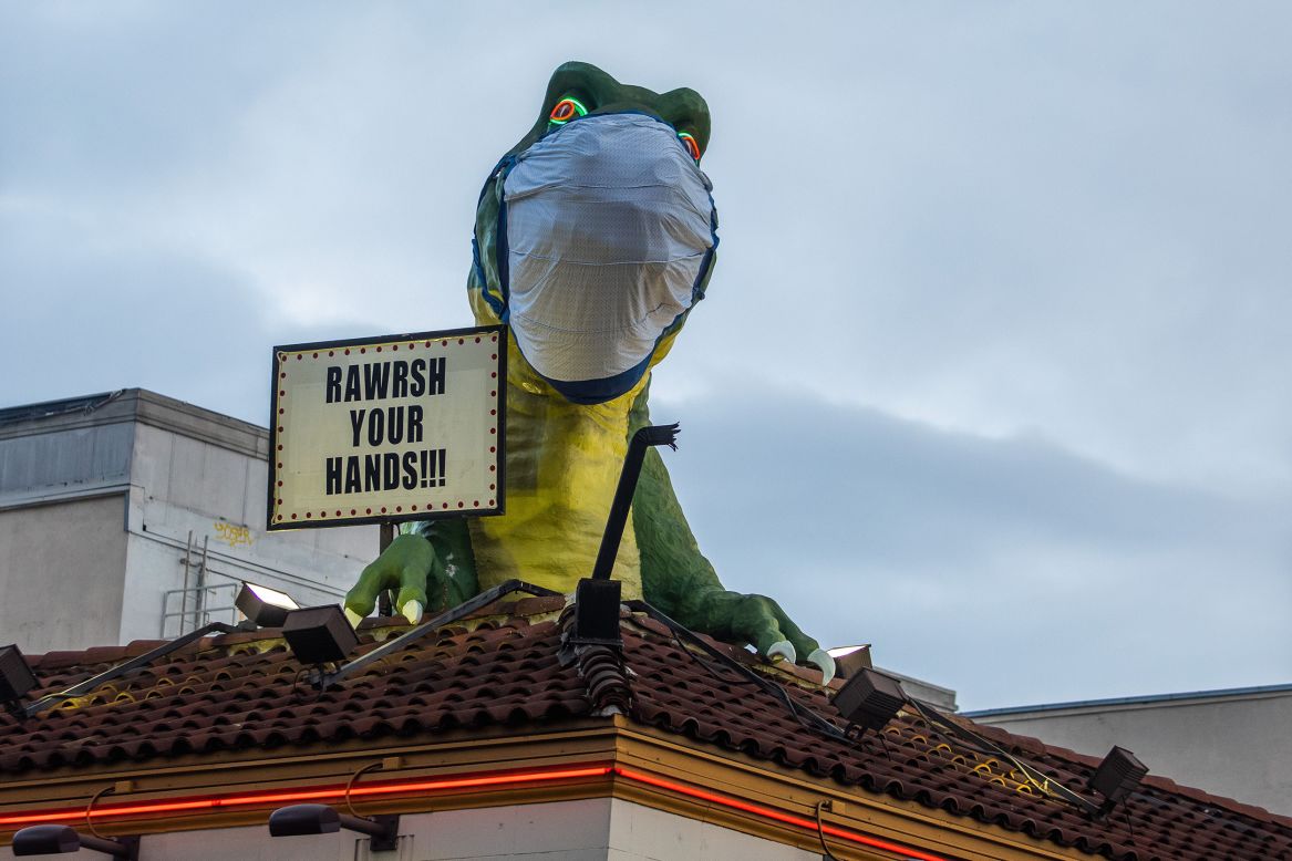 A dinosaur atop the Ripley's Believe It or Not museum in Hollywood encourages people to wash their hands on Sunday, April 19.