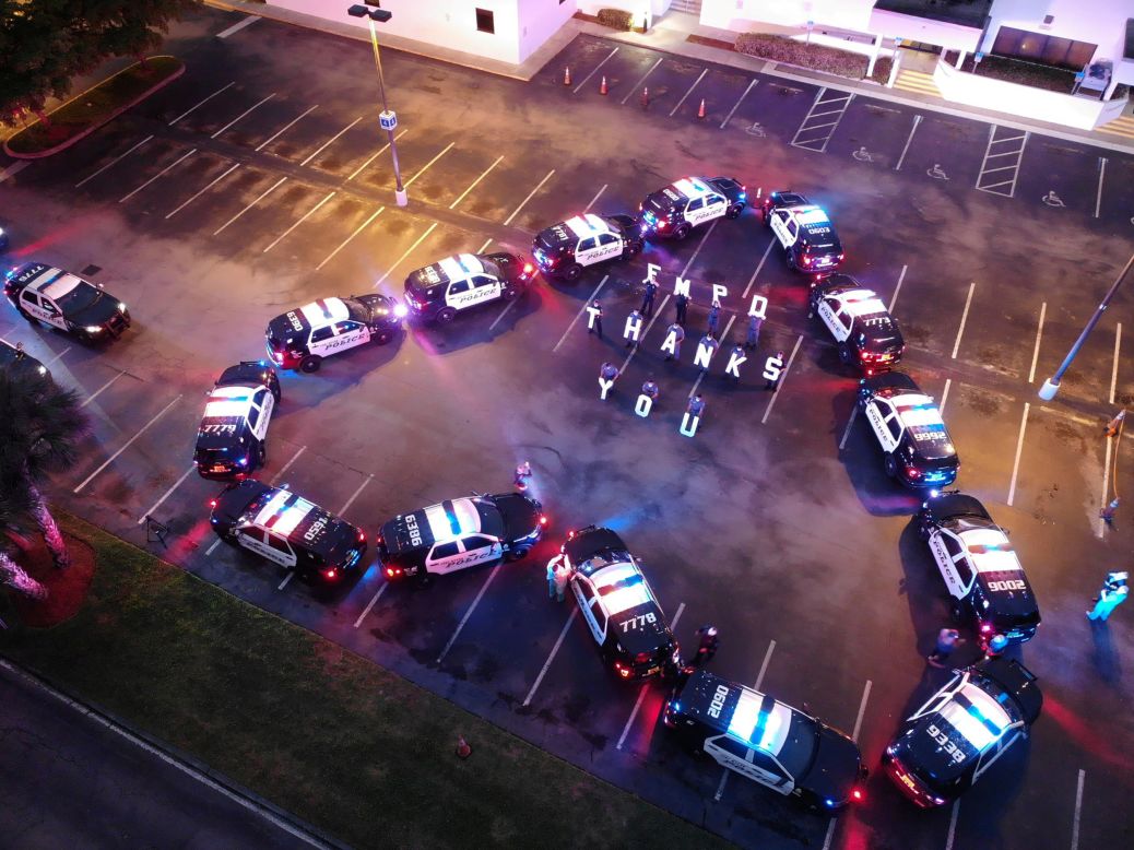 The Fort Myers Police Department makes a heart out of police cars to thank health-care workers at Lee Memorial Hospital in Fort Myers, Florida, on Thursday, April 16. 