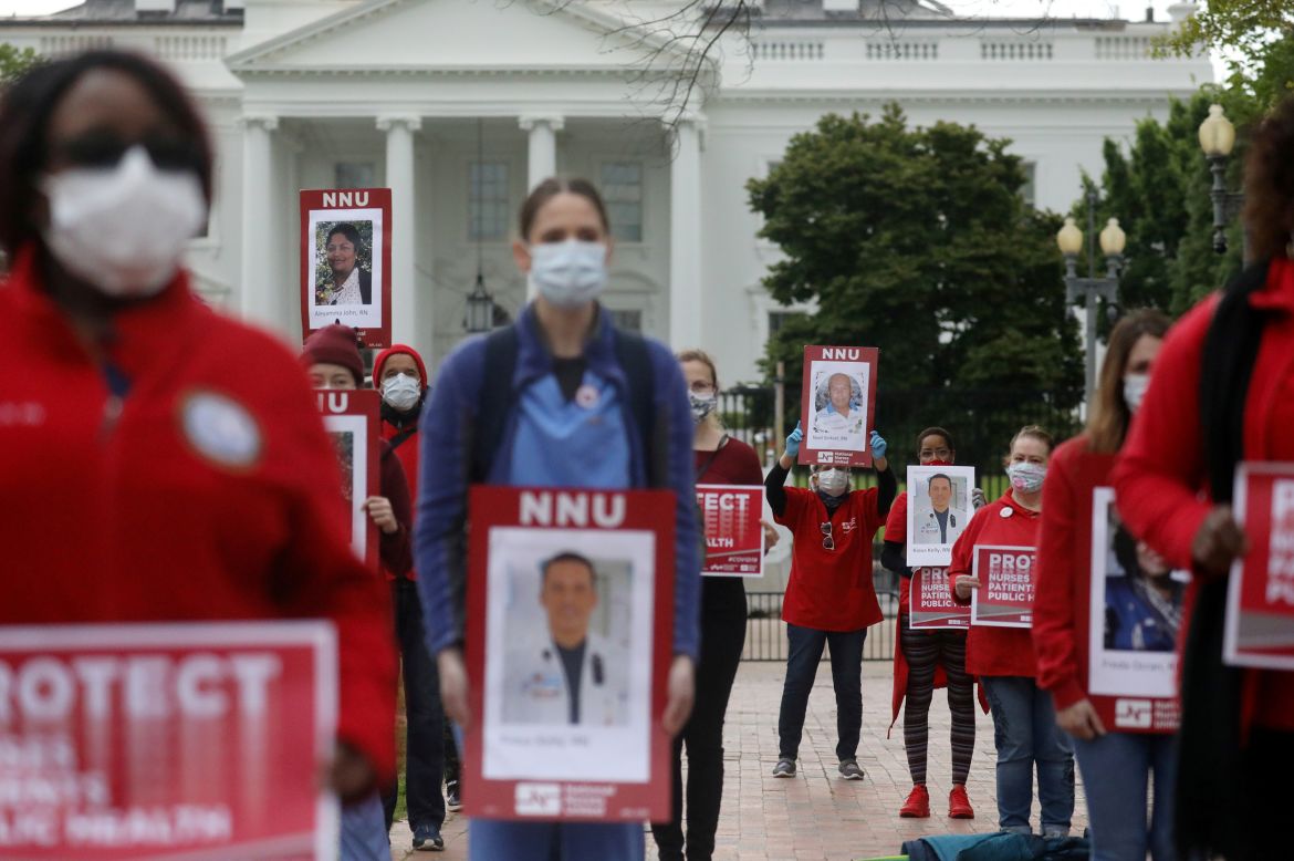 Nurses rally outside of the White House on Tuesday, April 21, calling on the Trump administration to order the mass production of personal protective equipment. 