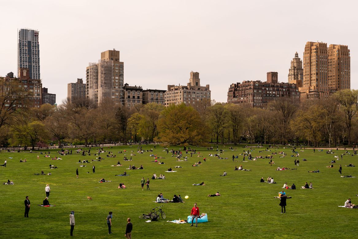 People relax in New York's Central Park on Sunday, April 19.