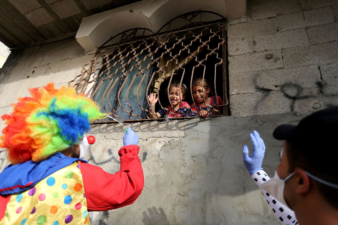 Clowns entertain children in Khan Younis, Gaza, on Sunday, April 19.