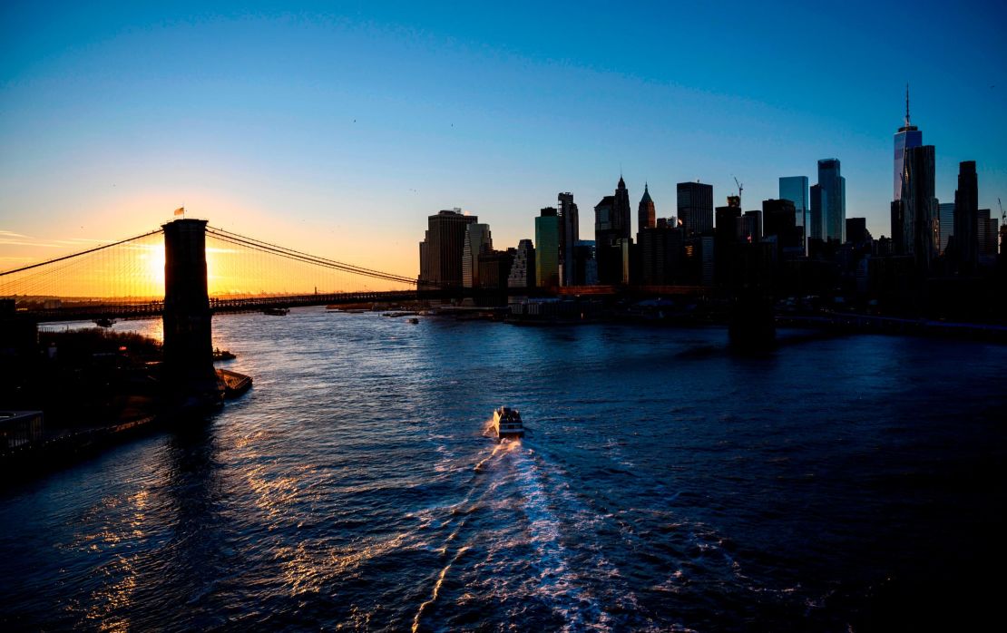 The Brooklyn Bridge leads to the skyscrapers of Manhattan.