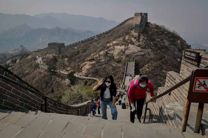 On April 14, people wearing protective face masks walk on a small stretch of the<a href="index.php?page=&url=https%3A%2F%2Fwww.cnn.com%2Ftravel%2Farticle%2Fbadaling-great-wall-china-reopens-intl-hnk%2Findex.html" target="_blank"> Great Wall of China</a> that had been reopened.