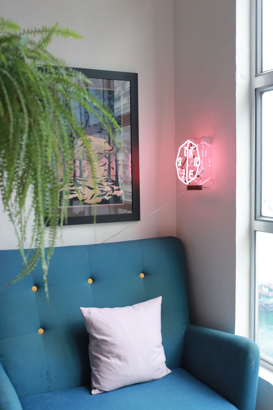 Bringing in decorative details, like lighting fixtures or wall art, can provide a boost of energy to a living space without over cluttering, Chow said.