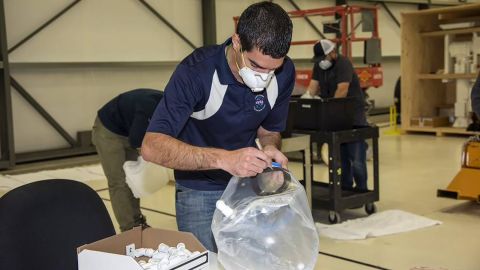 Engineer Mike Buttigieg of NASA works on the Aerospace Valley Positive Pressure Helmet.
