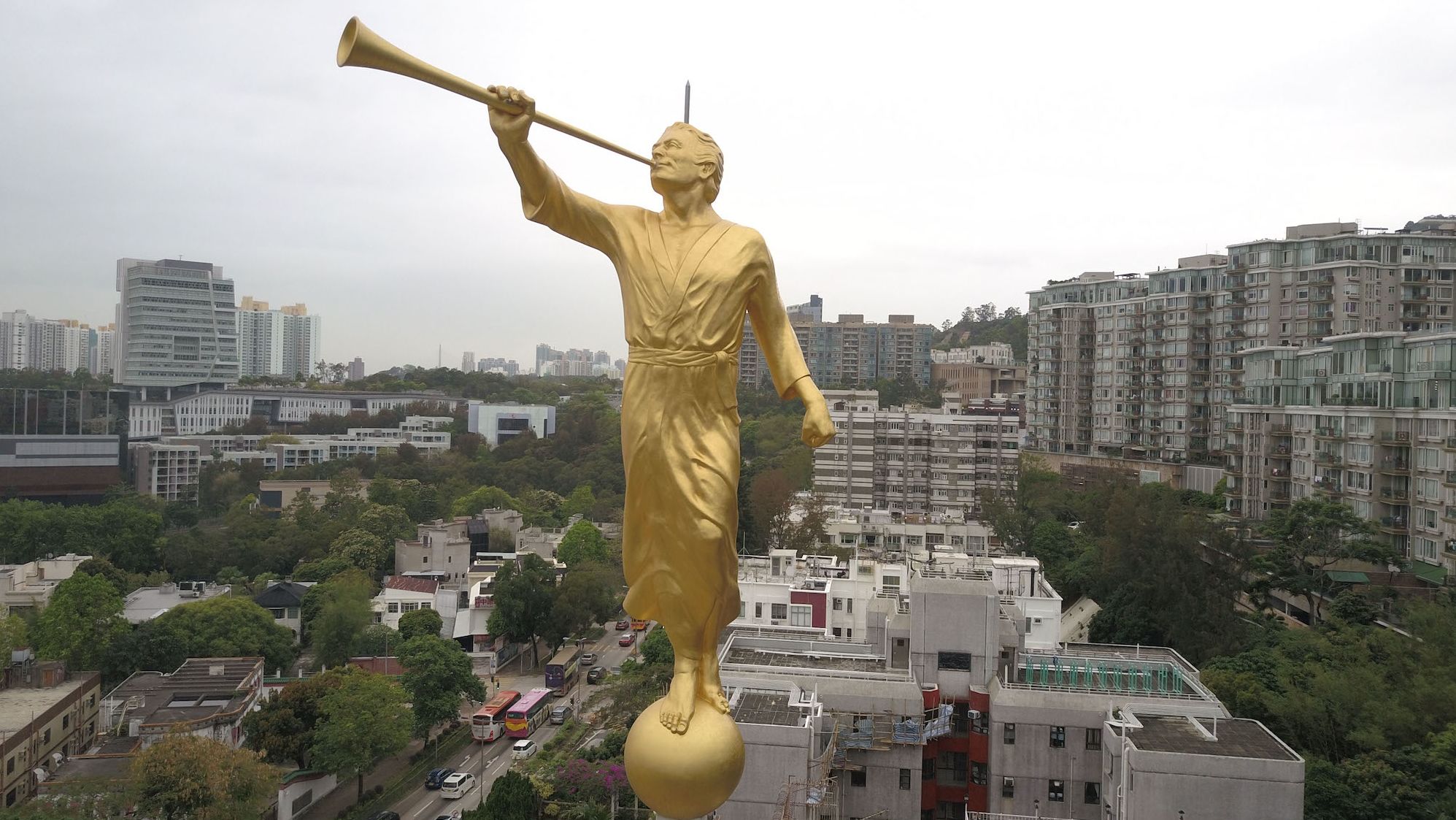 A statue of the angel Moroni, a key character in Mormon theology, seen on top of the Hong Kong Temple of the Church of Jesus Christ of Latter-day Saints in Kowloon, Hong Kong. 
