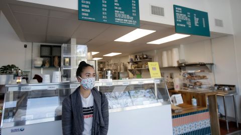 Rica Sunga-Kwan, owner of Churn Urban Creamery, wears a mask while interviewed at her shop in San Francisco on Thursday, April 23.