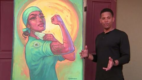 Terrance Osborne, who painted emblematic scenes of Hurricane Katrina, talks beside his latest work, inspired by the coronavirus battle.