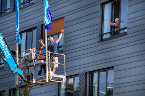 Pitrik van der Lubbe waves from a boom lift to his 88-year-old father, Henk, at his father's nursing home in Gouda, Netherlands. Pitrik had not seen his father in more than four weeks.