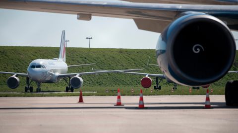 A picture taken on March 24, 2020, shows grounded airplanes at the Roissy-Charles de Gaulle airport in Roissy-en-France, north of Paris, on the eight day of a lockdown aimed at curbing the spread of the COVID-19 (novel coronavirus) in France. - The southern Orly airport could close by the end of the month and Paris' airport activity regrouped at the northern Charles-de-Gaulle airport, due to a drop in air traffic caused by the outbreak of COVID-19, the French Junior minister for Transports  said on March 22, 2020. (Photo by  Thomas Samson/AFP/Getty Images)