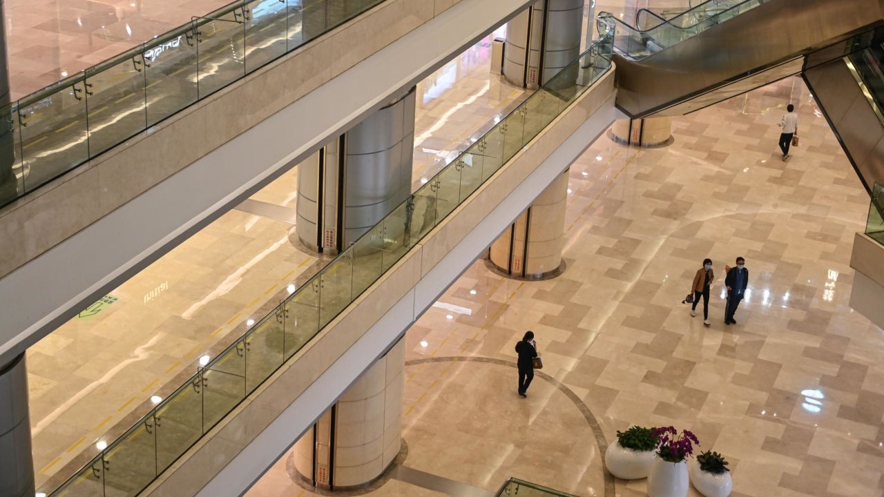 People wearing face masks in a shopping mall in Wuhan, Hubei province, as the city tries to go back to business after the lockdown on April 18.