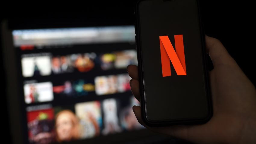 In this photo illustration a computer and a mobile phone screens display the Netflix logo on March 31, 2020 in Arlington, Virginia. (Photo by Olivier DOULIERY / AFP) (Photo by OLIVIER DOULIERY/AFP via Getty Images)