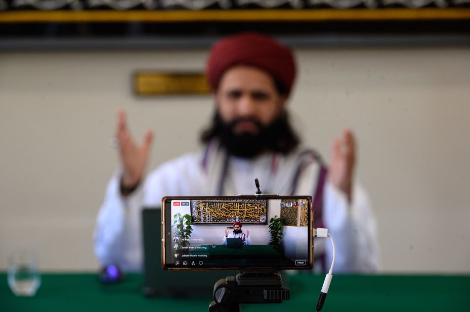 Imam Hassanat Ahmed delivers his Friday broadcast, "Preparing for a Unique Ramadan," in an empty Noor Ul Islam Mosque in Bury, England. It was delivered via social media.