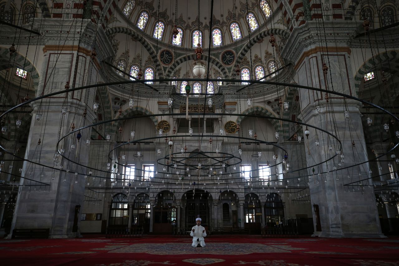 Esat Sahin, imam of the iconic Fatih Mosque, holds a prayer without public attendance in Istanbul.