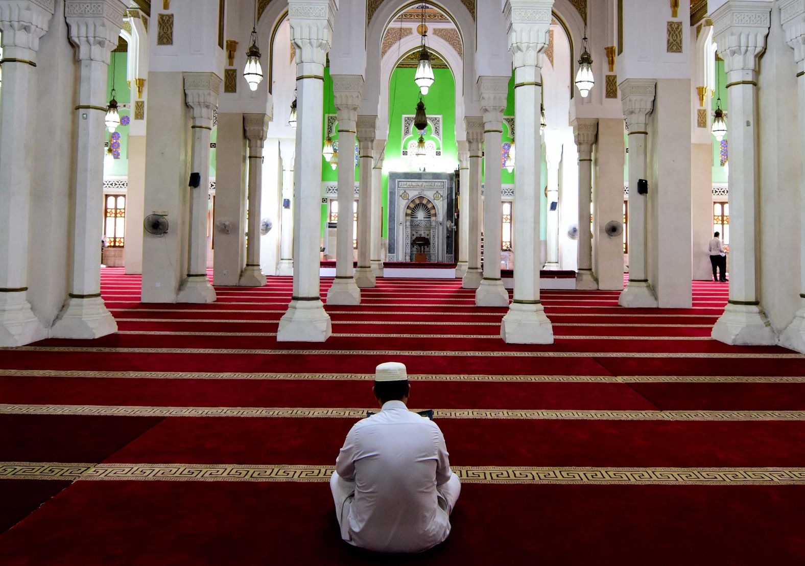 An Iraqi Sunni cleric of Sheikh Hameed reads the Quran at the Umm Al-Tabool Mosque in Baghdad, Iraq.