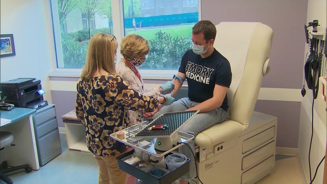 Sean Doyle has his blood drawn as part of a vaccine trial for coronavirus at Emory University.