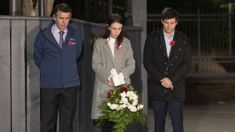 New Zealand Prime Minister Jacinda Ardern, center, with her father Ross Ardern, left, and partner Clarke Gayford stand outside Premier House in Wellington to mark Anzac Day on April 25. 
