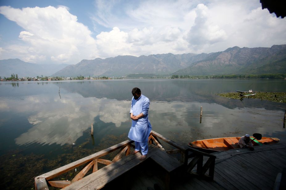A man prays on the banks of Dal Lake in Srinagar, India, on April 26.