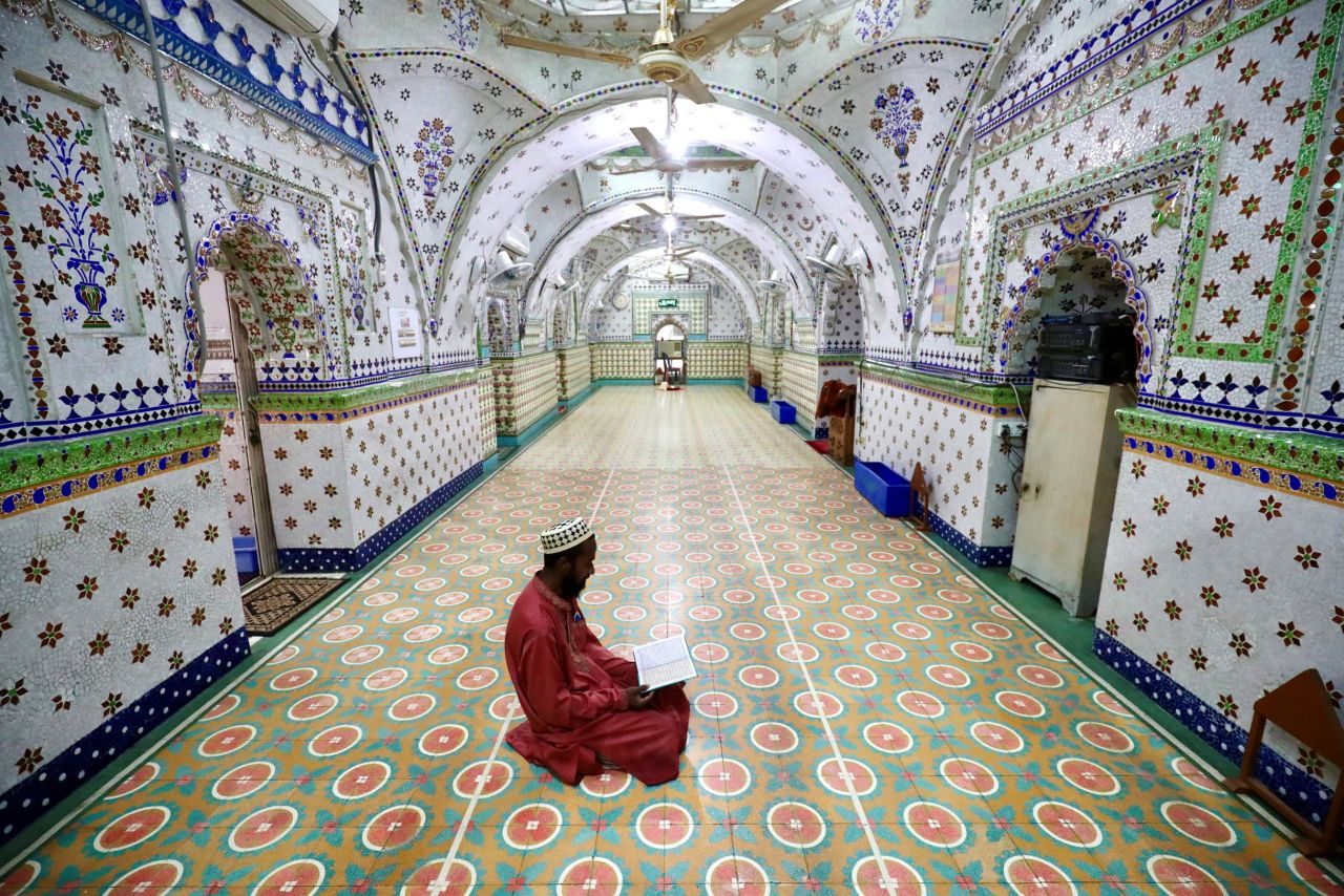 A devotee recites the Quran at the Star Mosque in Dhaka, Bangladesh, on April 26.